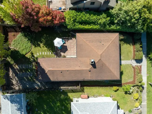 The overhead photo of the property shows the spacious garden and lot with private fenced backyard.