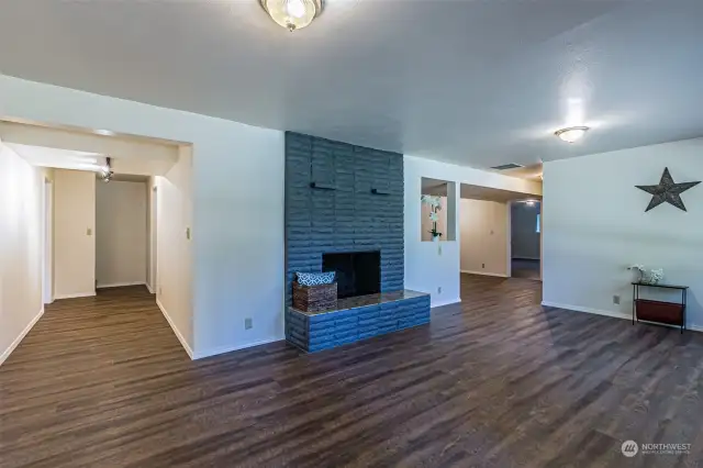 Living Room Downstairs. Hallway come from the upstairs entrance to downstairs and utility room / garage doors