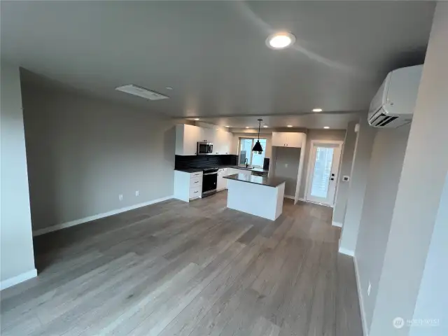 Looking back at kitchen with door to right leading to the spacious deck