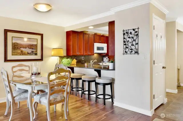 Dining room, and the closet in entry is the stack washer and dryer.