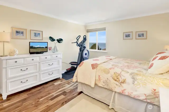 Primary bedroom with bay views, and feel the sea breeze.