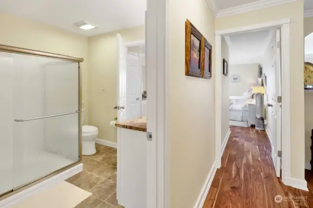 Hallway with full bath separates the bedrooms.