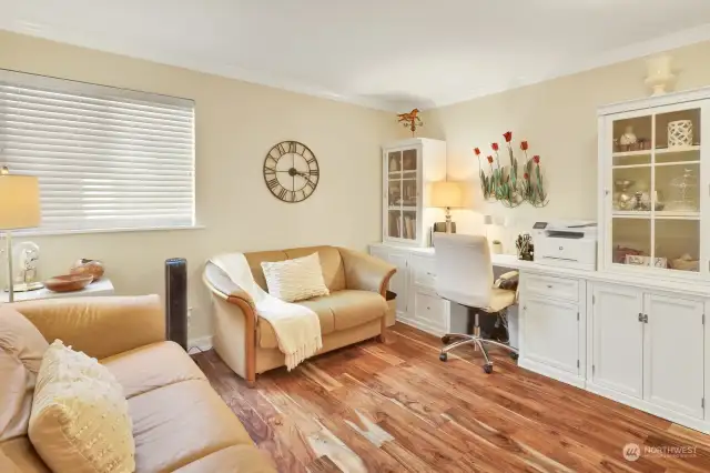 Second bedroom with closet that faces State St. Easy care wood floors.