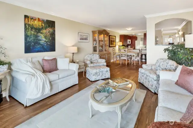 Living room view from sliding looking toward dining and kitchen. Easy care wood floors.