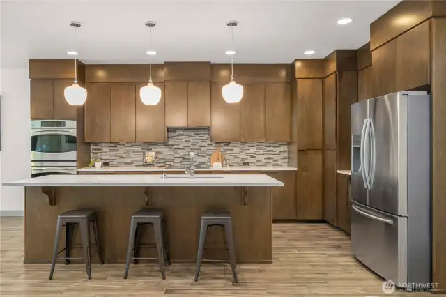 The kitchen is fixed with ample counter space, cabinet space, and a large island