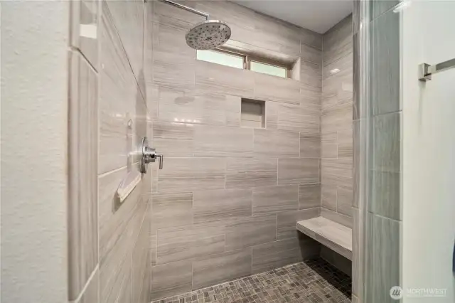 Standing walk-in shower with glass