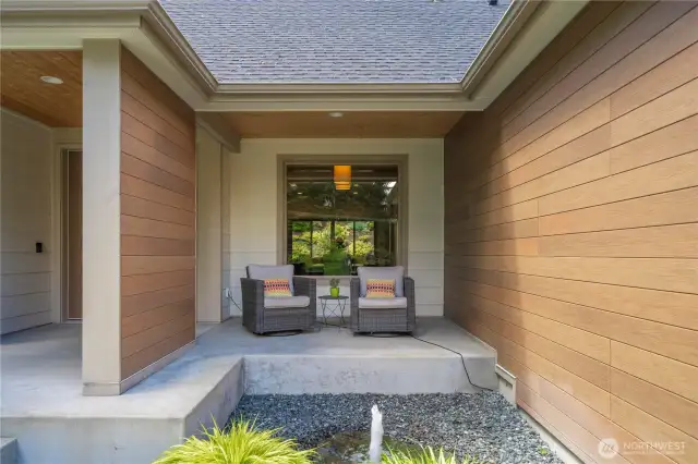 A cozy patio greets you before you step in to find a home of luxury!