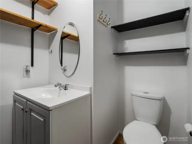 The utility room also doubles as a powder room for extra convenience.