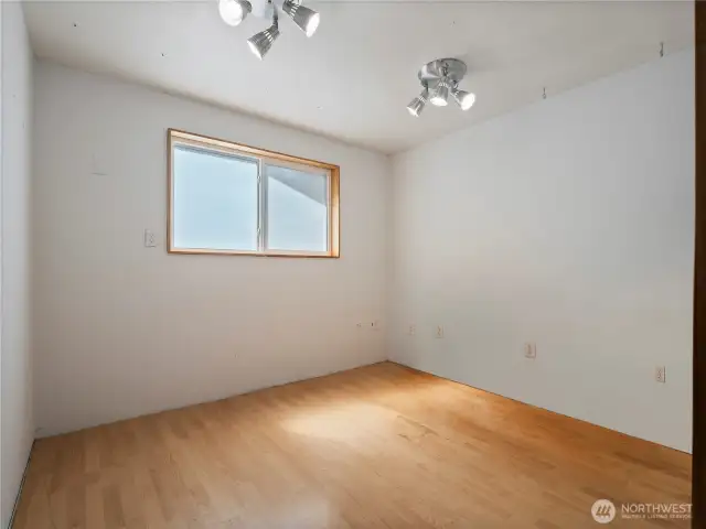 This space is an extra finished room in the garage. It's perfect for storage, shop space,