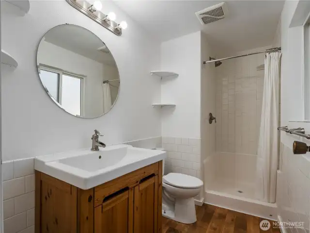 The primary suite includes this roomy bathroom with a large walk-in shower.