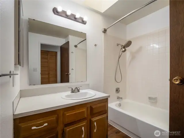 This large, full bathroom serves the remaining bedrooms.