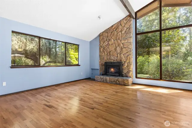 Soaring picture windows, stone faced chimney, fireplace insert, vaulted ceilings... this place has it all!