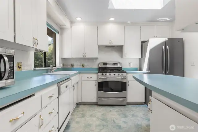 Abundant natural light in the kitchen w/ skylight, and plenty of storage!