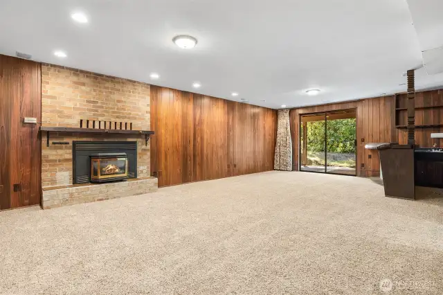 Great room w/ wet bar, propane fireplace and slider to the covered patio