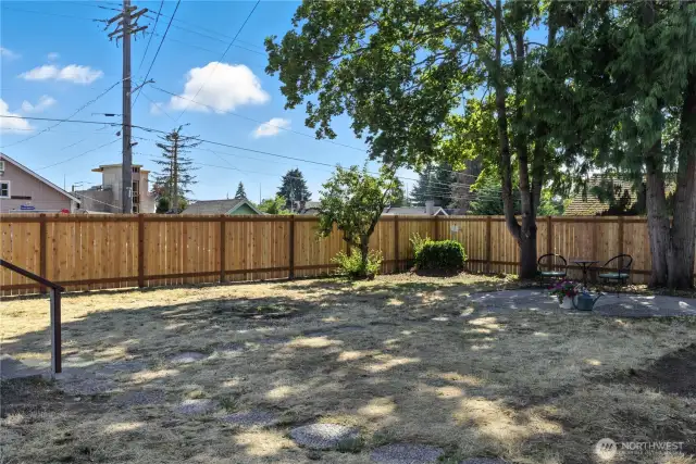 Another View of the New Fence and Lovely Backyard Patio. Area could be used as an DADU or Detached Additional Dwelling Unit.