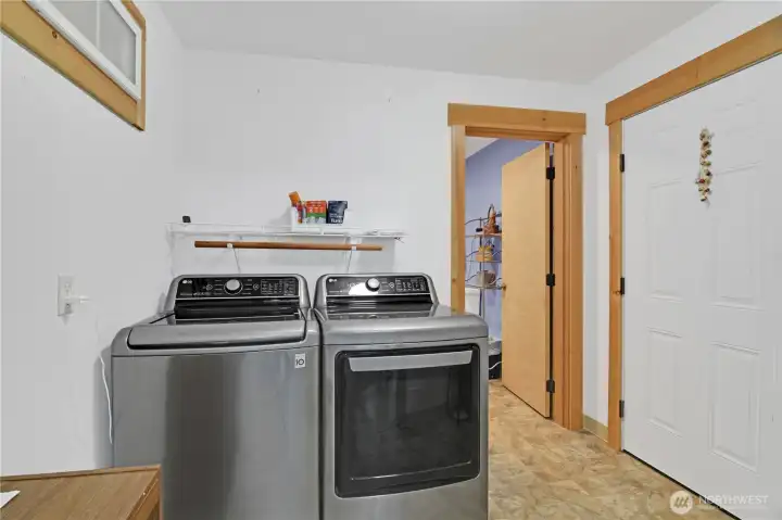 Utility room just off main entrance from garage and home with included smart washer and dryer