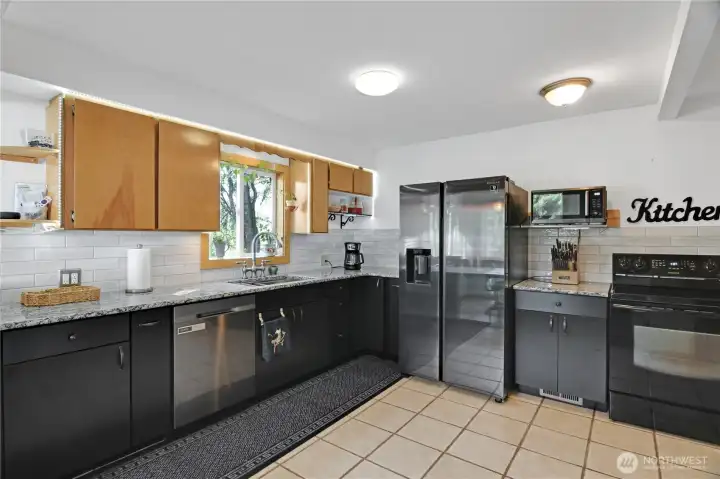 beautifully updated kitchen with LED sparkle lights around upper cabinets