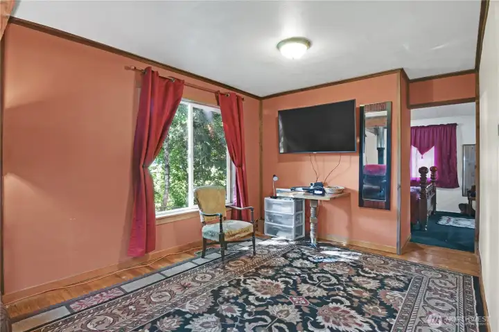 living room is very large and leads to the primary bedroom