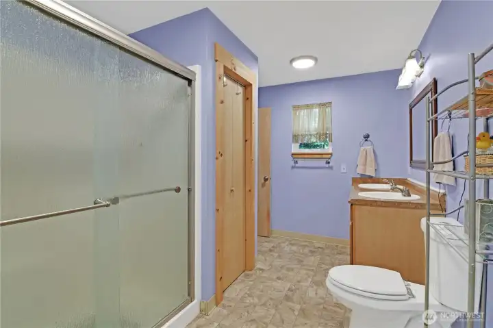 updated jack/jill bathroom with double sink and large shower off the Primary bedroom and Laundry room