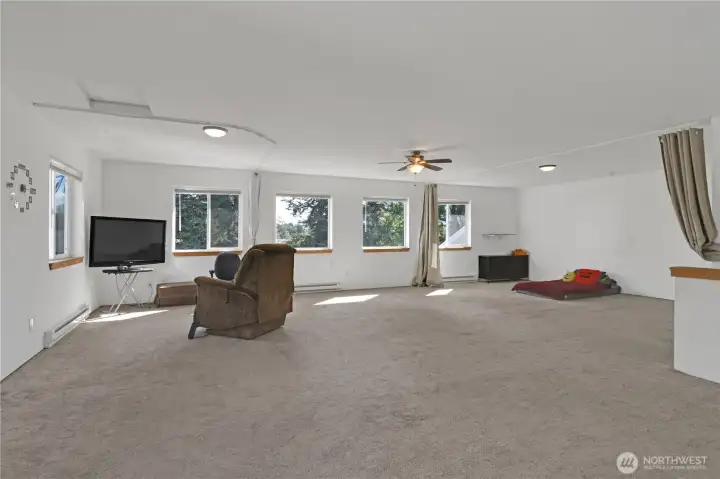 Large room could easily become 4 bedroom with half bath below in garage.