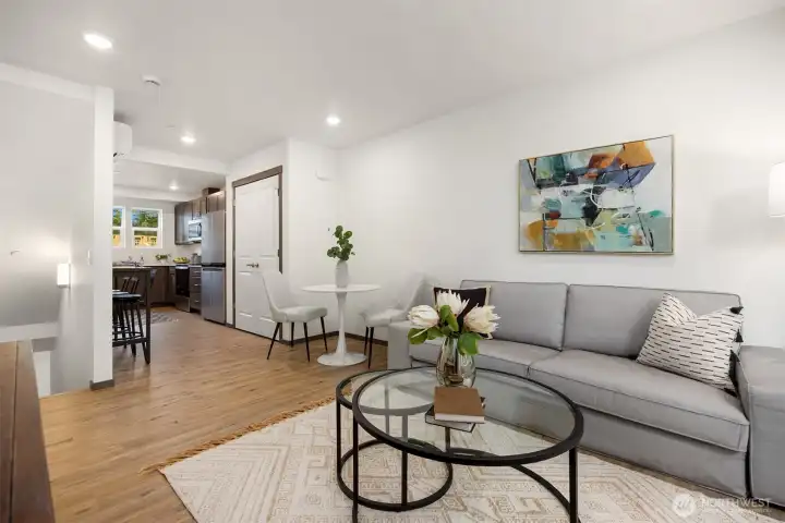 The open living area offers a warm and inviting space to gather, relax, and connect.