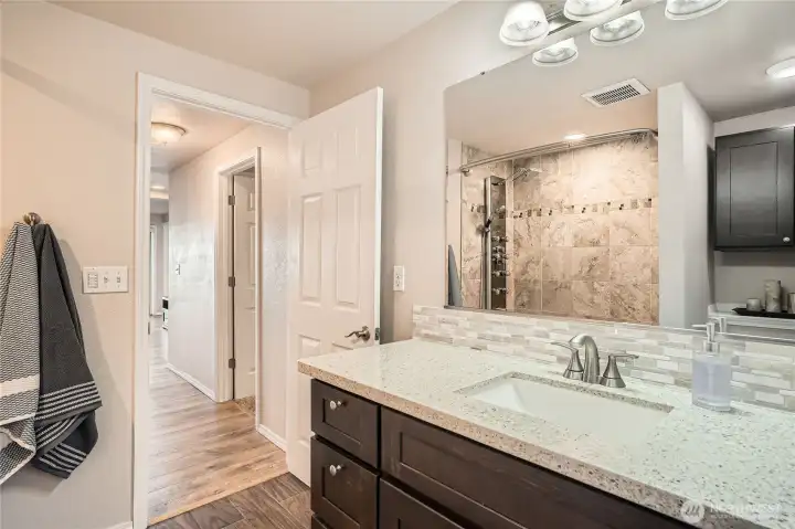 Primary bathroom with deluxe shower panel.