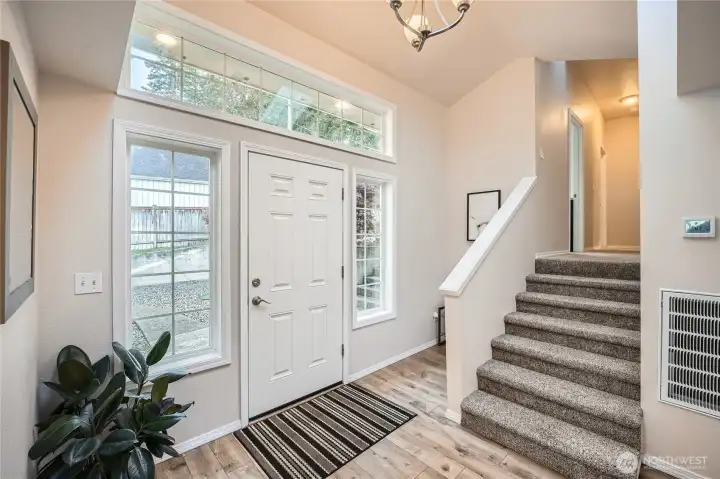 Entry. Go up 1/2 flight stairs to the right to 3 bedrooms and the 2nd bath (addition added in 1980s). Left goes to kitchen, living room and the rest of the house.