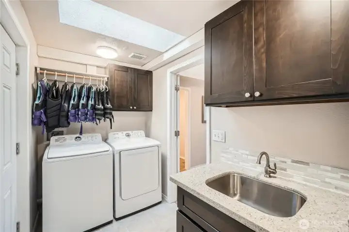 Laundry and mud room with access to outside.