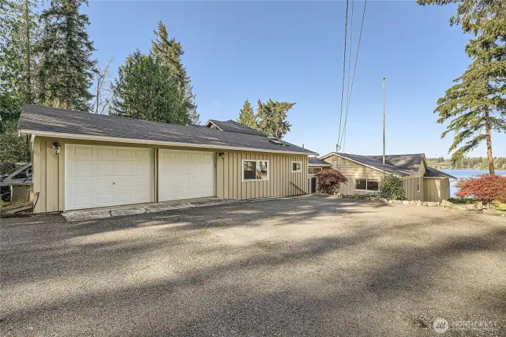 460ft (oversized) 2-car garage with large paved parking area. More parking off driveway as well.