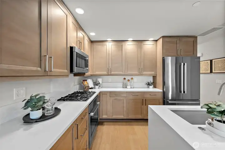 Stainless appliances, gas stove stop, above stove microwave opens up counter space.