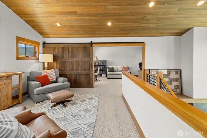 Upper level featuring a bonus room and a private office that can be closed off for added privacy and focus.