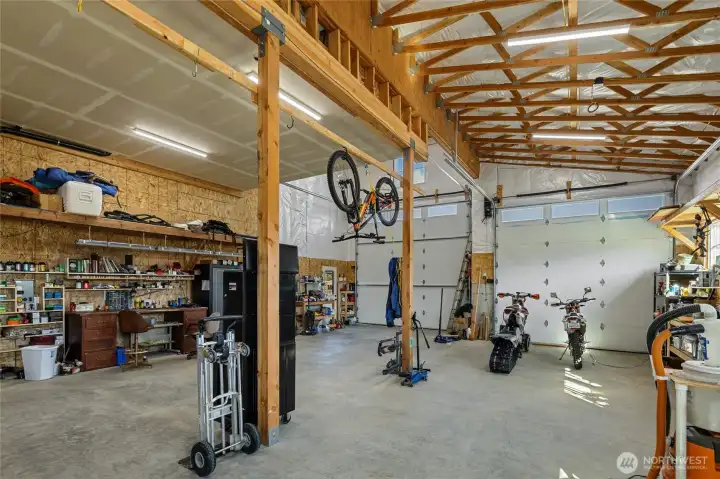 Shop with two large electric doors, providing ample access for larger vehicles.