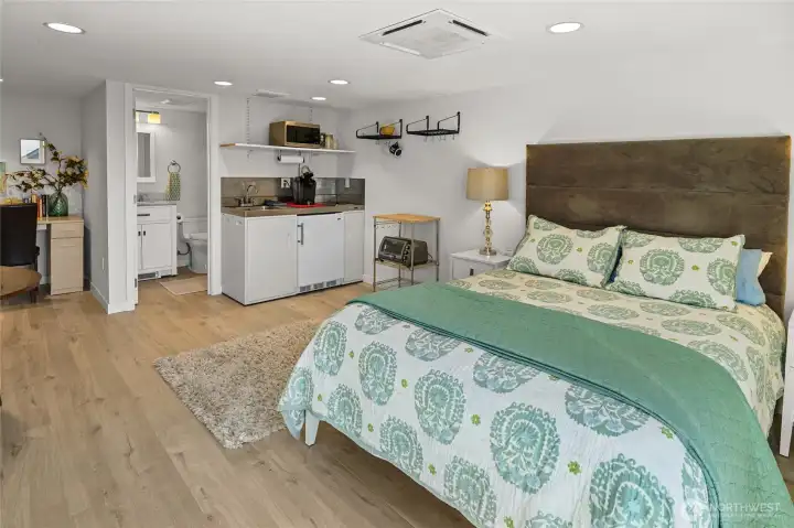 Bonus room with multiple uses, featuring a kitchenette and a ¾ bath, ideal for guest overflow or flexible living space.
