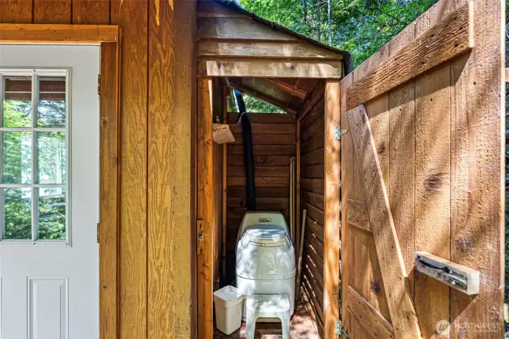 Biodegradable toilet in its own space.