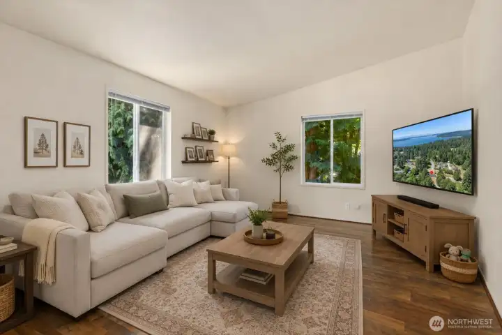 The separate family room offers a comfortable and versatile gathering space beyond the main living area. Perfect for movie nights, game days, or simply relaxing, this inviting room provides additional flexibility for everyday living. [Photo is virtually staged]