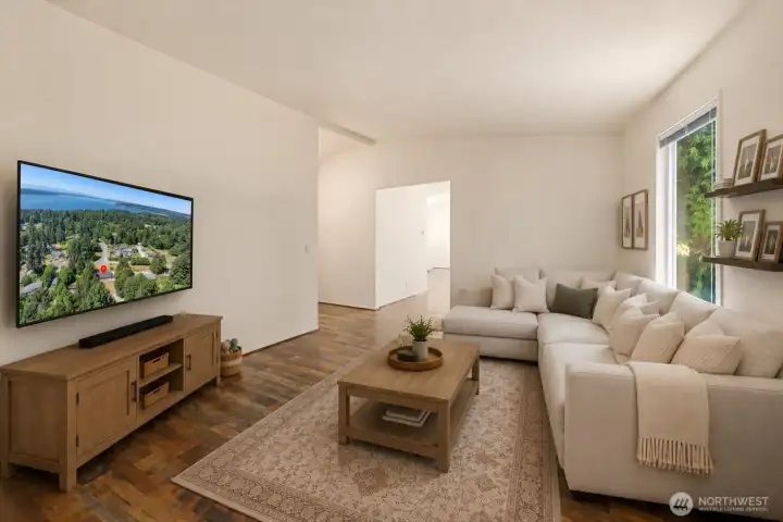 Its separation from the primary living spaces creates opportunities for multiple activities to happen simultaneously while still maintaining a connected feel throughout the home. [Photo is virtually staged]