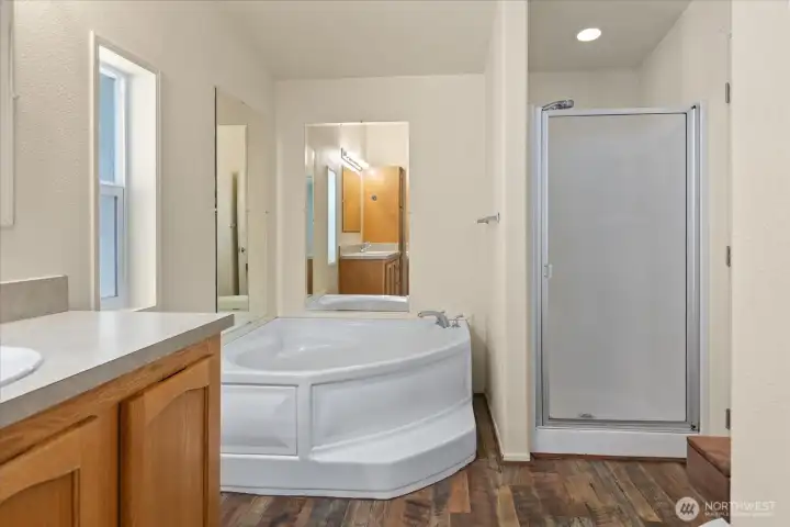 The spa-inspired ensuite bath features a soaking tub, separate shower, and generous space to unwind and recharge.