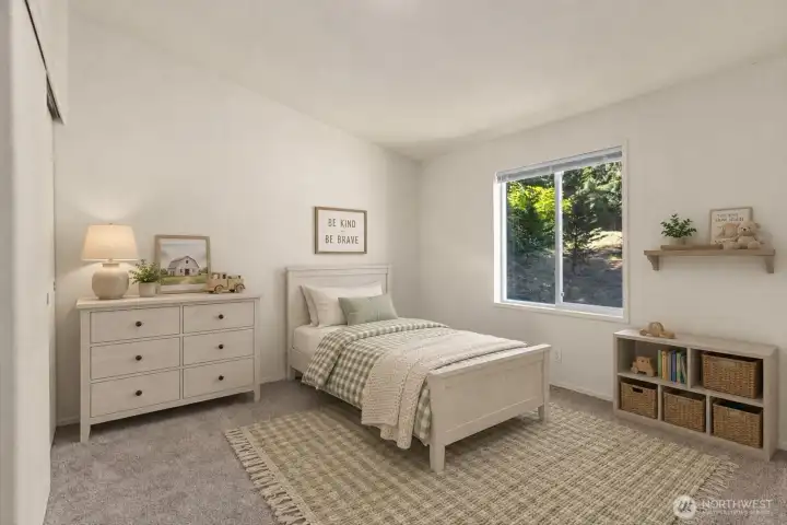 Comfortable secondary bedroom ideal for family, guests, or multigenerational living. Positioned opposite the primary suite for added privacy. [Photo is virtually staged]