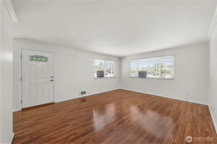 This is the upper 2 bedroom unit number 3 with laminate wood flooring.
