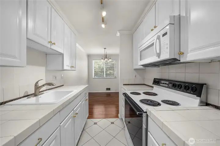 Update kitchens with tile flooring & newer white cabinets