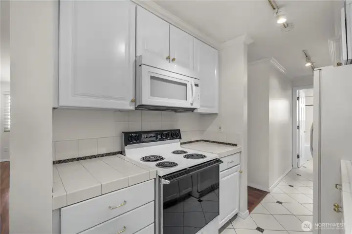 Update kitchens with tile flooring & newer white cabinets