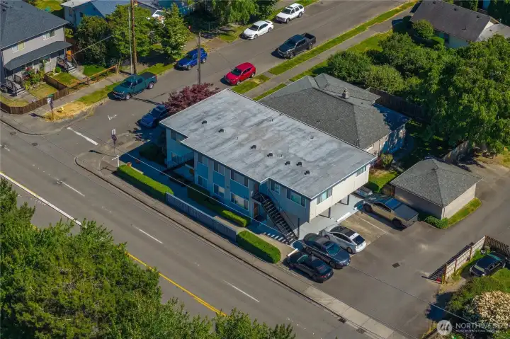 This aerial photo shows the newer roof replaced in 2020 by Bravo Roofing with a transferrable 12 year warranty