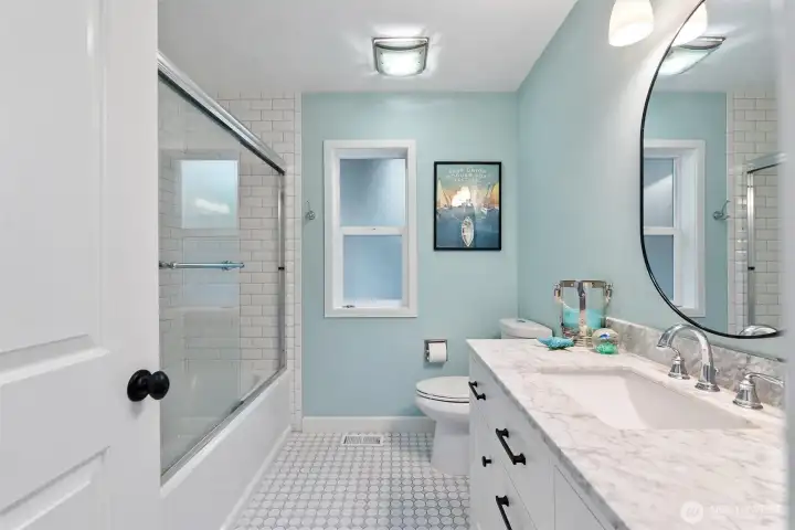 Bathroom with tub and shower