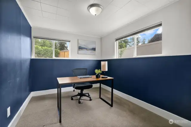 Whether used as a remote office or guest bedroom, the space is  bright and quiet from the upper level.
