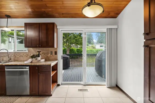 Outdoor deck access is located off the kitchen through sliding glass doors for easy summer entertaining.