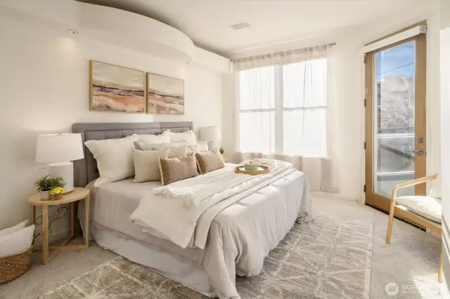 Welcome to this gorgeous primary suite, with deck access and stunning views behind the sheers in the window.
