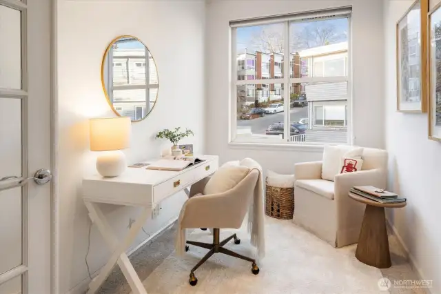 This darling bedroom with French Doors was just carpeted and overlooks the fountains in the entry area of the condo building.