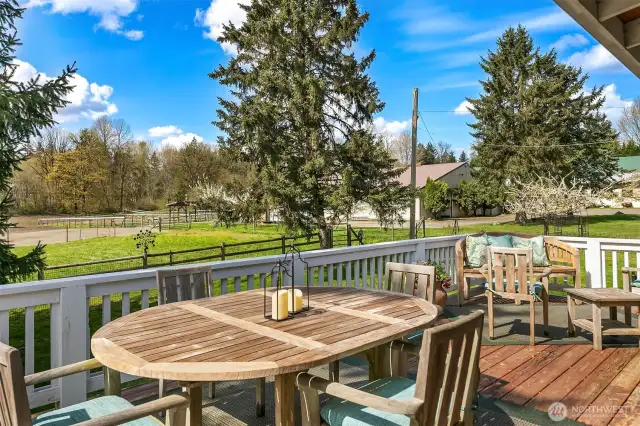 Large outside back deck looks out to private yard and