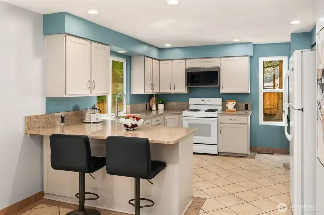 Kitchen with quartz & gas range. Huge pantry and coffee bar area too.