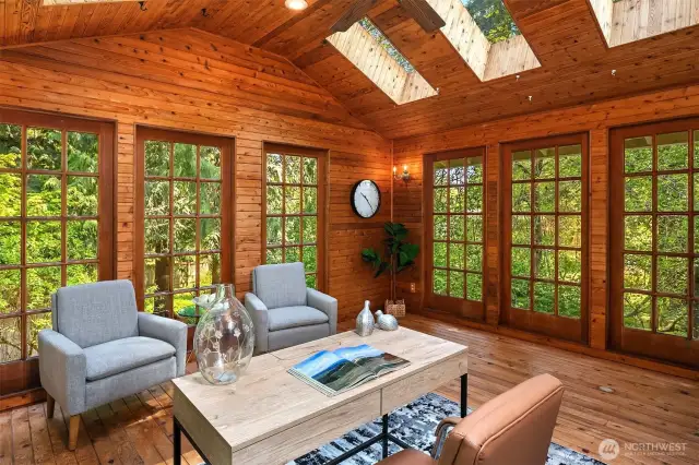Owner Suite sunroom with walls of colonial windows to the private backyard!